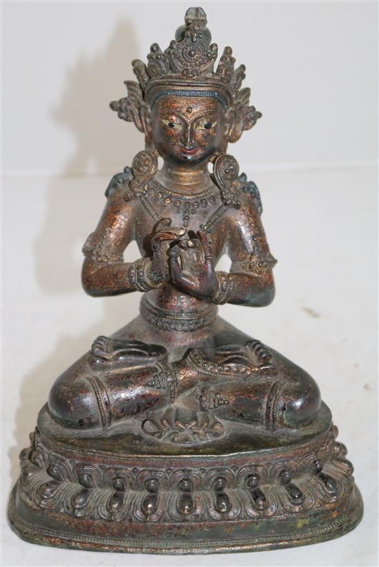 A Sino-Tibetan lacquered bronze seated figure of a Bodhisattva, 16th/17th century, height 23cm